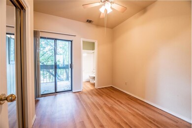 Unfurnished room featuring light wood-style floors and a ceiling fan