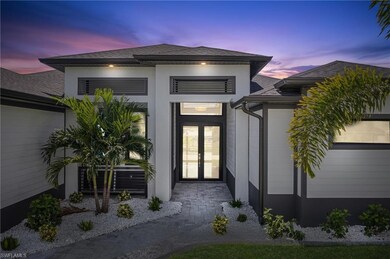 Exterior entry at dusk with french doors