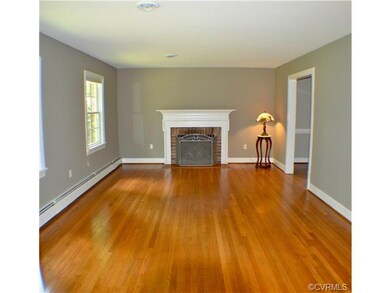 living room with wood burning fireplace