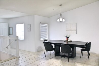 Dining room featuring a notable chandelier, basebo