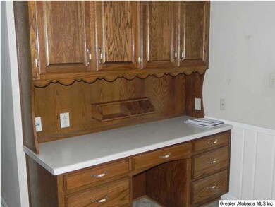BUILT-IN CHINA CABINET IN THE BREAKFAST AREA.