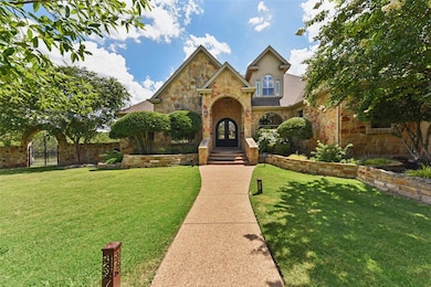Traditional-style house with stone siding and fre