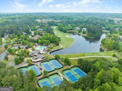 Aerial view of tennis courts & lake