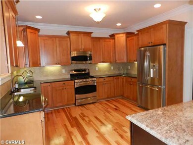 Kitchen - Gourmet kitchen with maple cabinets, island with expresso stain, GRANITE, SS appliances, desk area with wine shelf and mail slots.