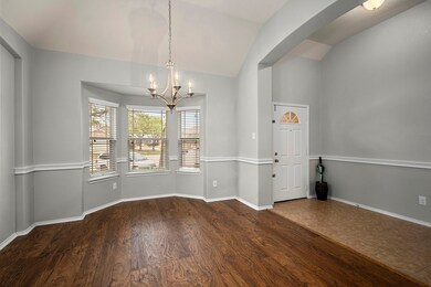 As you enter the home you will find the formal dining room on your right.  Hardwood floors make this space feel luxurious along with the chair rail and vaulted ceilings.  The entire home has just been painted giving you a blank slate to make it your own!