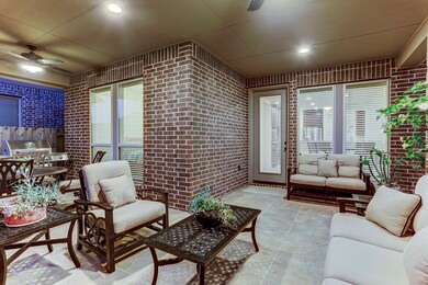 EXPANDED COVERED PATIO... Tile flooring, ceiling fan with light kit, recessed lighting.