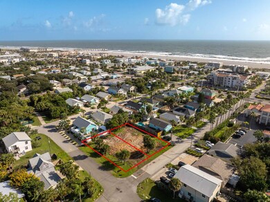 Aerial overview of property's location with property parcel outlined and unending shoreline