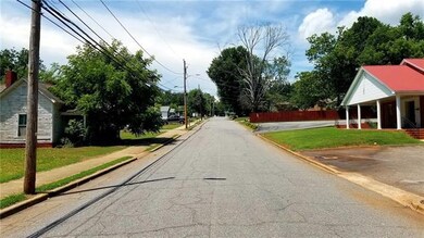 Paved City of Newton Street Frontage with Sidewalk