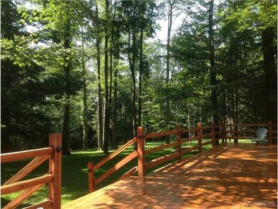 Deck. This quality red cedar deck has a rustic spl
