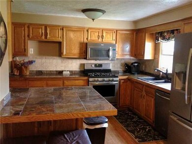 Kitchen Sharp oak kitchen with hardwood floors, cu