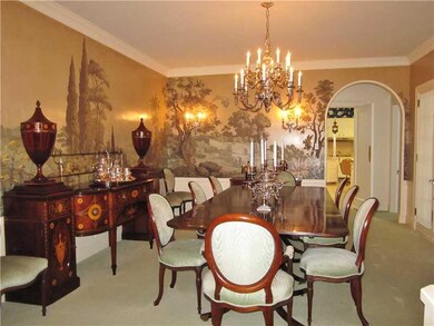 Dining Room. stately crown molding, sconces & chan