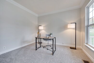 Front office with double doors and lots of natural light.