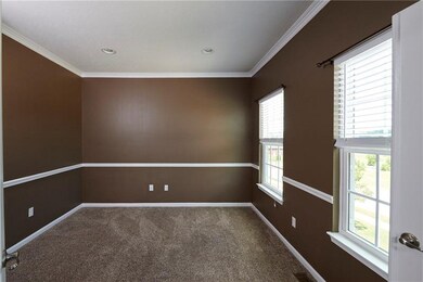 Highlights include crown molding, chair rail, and 