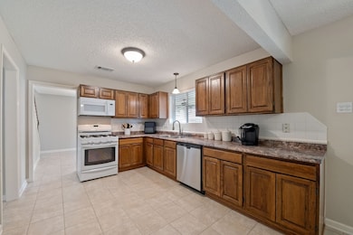 Kitchen is directly off the dining room and boasts