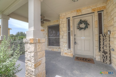 Covered front porch with ceiling fan