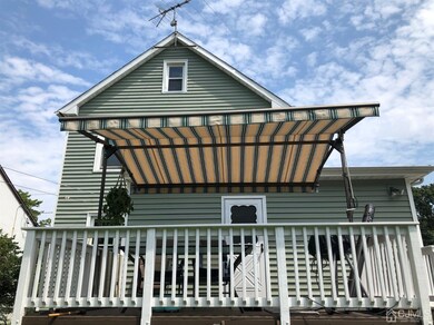 Backyard deck with shade shown