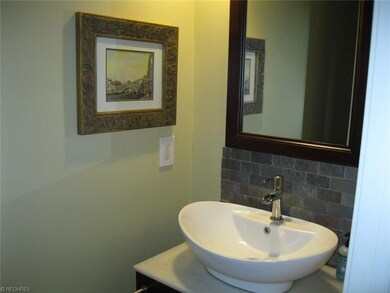Updated powder room is located right off the foyer