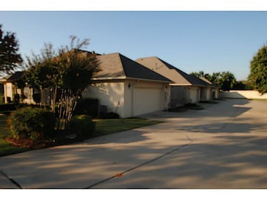 Exterior Front. Large shared driveway.  First garage with easy access