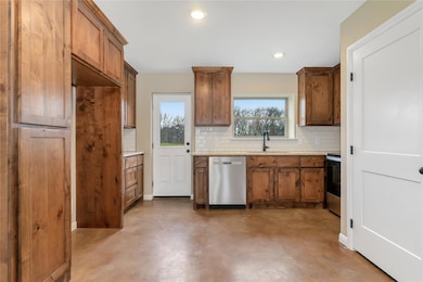 Kitchen featuring stainless steel appliances, sink