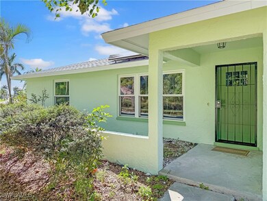 View of exterior entry with stucco siding