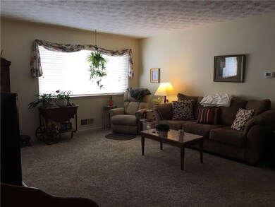 The extra-large picture window and neutral decor m