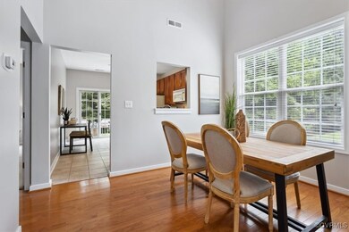 Home office with light hardwood / wood-style floor