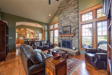 Living room with open floor plan, vaulted ceilings