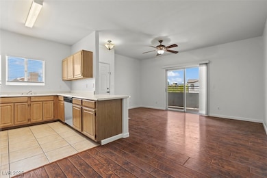 Kitchen with a peninsula, open floor plan, light c