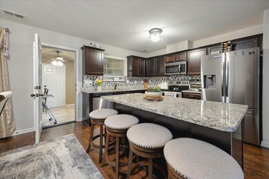 Kitchen featuring dark hardwood / wood-style floor