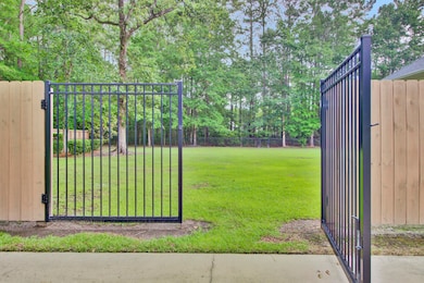 4. 1 of 2 twelve ft gates giving access