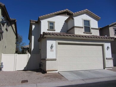 GARAGE ENTRY AND SIDE YARD FROM REAR