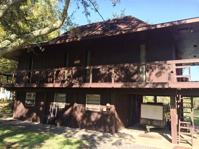 Front with carport & deck