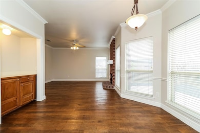 Unfurnished living room with dark wood-type floori