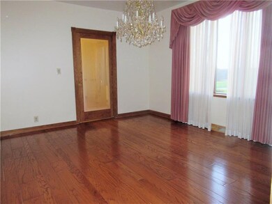 The 14x12 ft. formal dining room boasts gleaming h