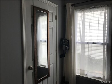 walk in closet as you enter the front door