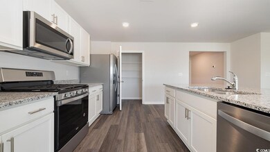 Kitchen with sink, appliances with stainless steel
