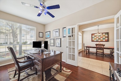 VIEW TOWARDS THE ENTRY AND DINING/ DOUBLE GLASS PANE DOORS