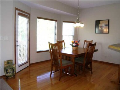 The dining room features hardwood floors, a expans