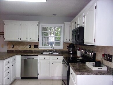 Beautiful Kitchen with new stainless steel dishwasher and stove.
