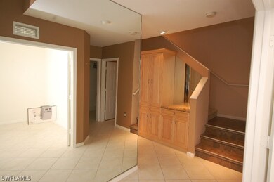 As you walk in the front door there is a mirror wa