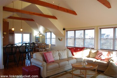 Large open living room, kitchen and dining area with ocean views