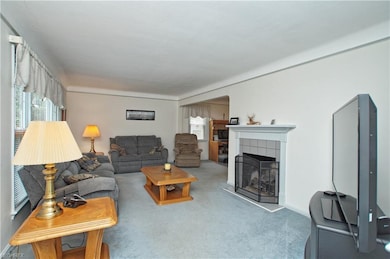 Carpeted Living room with hardwood floors has a  G