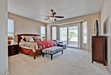 Master with doors to yard and pool