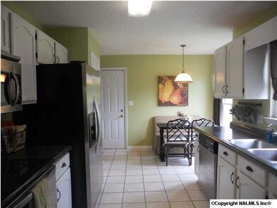 The kitchen is a cook's delight! It has ceramic tile floor, a pantry and a cozy breakfast area.