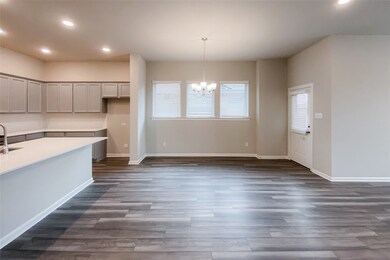 Well-lit eat-in dining area just adjacent to the kitchen