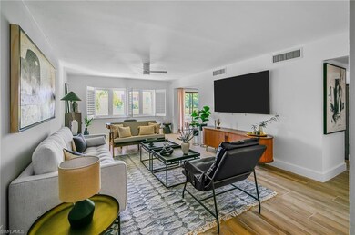 Living area with baseboards, ceiling fan, visible 