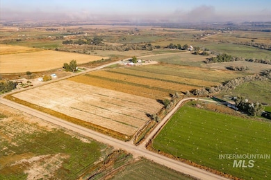 Aerial overview of property's location with rural landscape and extensive farmland