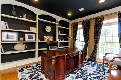 Home office with great built in shelves for your books and photos.