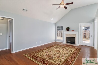 Living room w/vaulted ceiling, fireplace and oak f