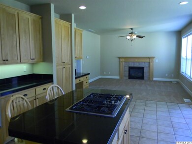 A place to gather with downdraft gas cooktop. Kitc